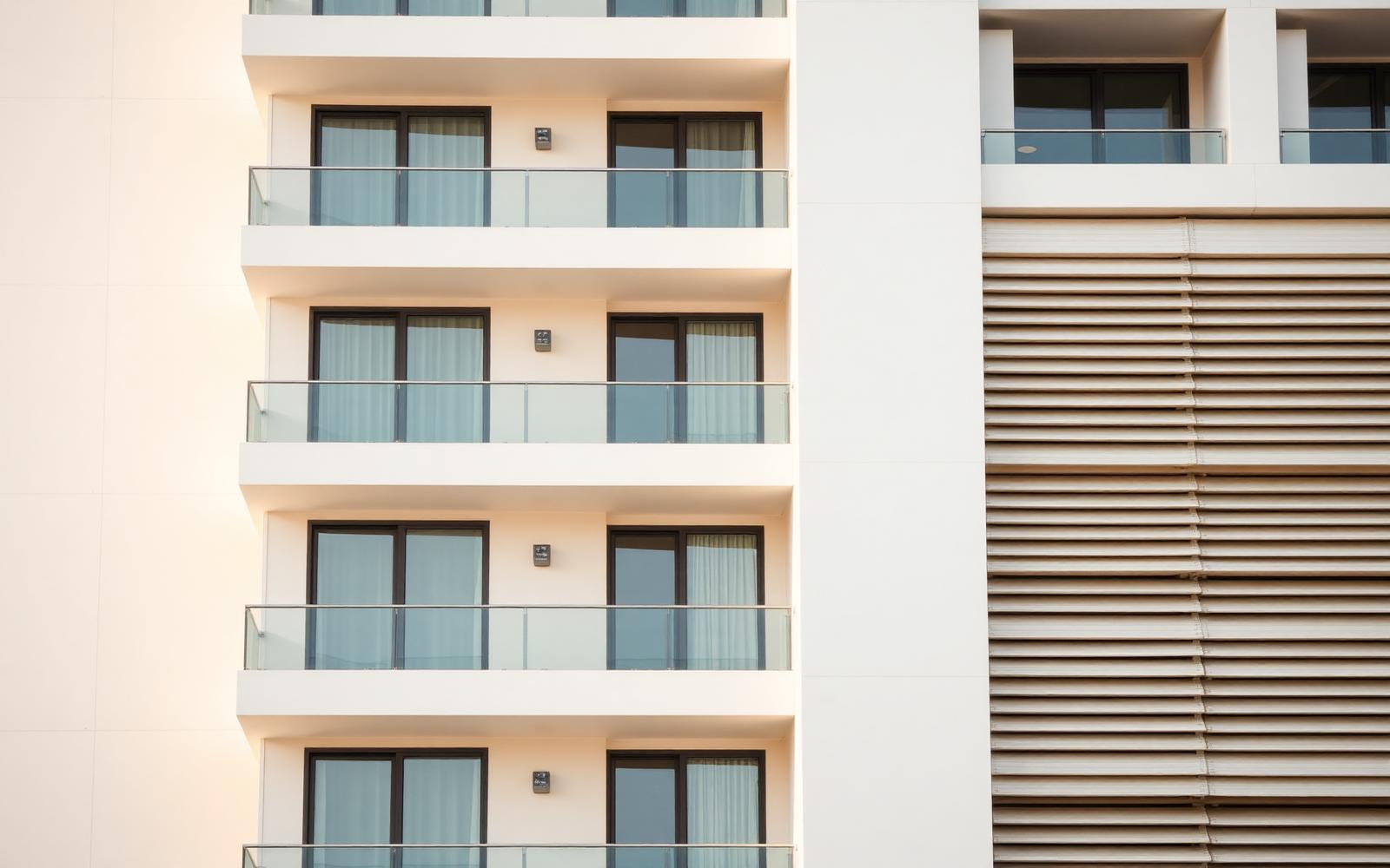 Modern hospitality building facade in warm neutral tones